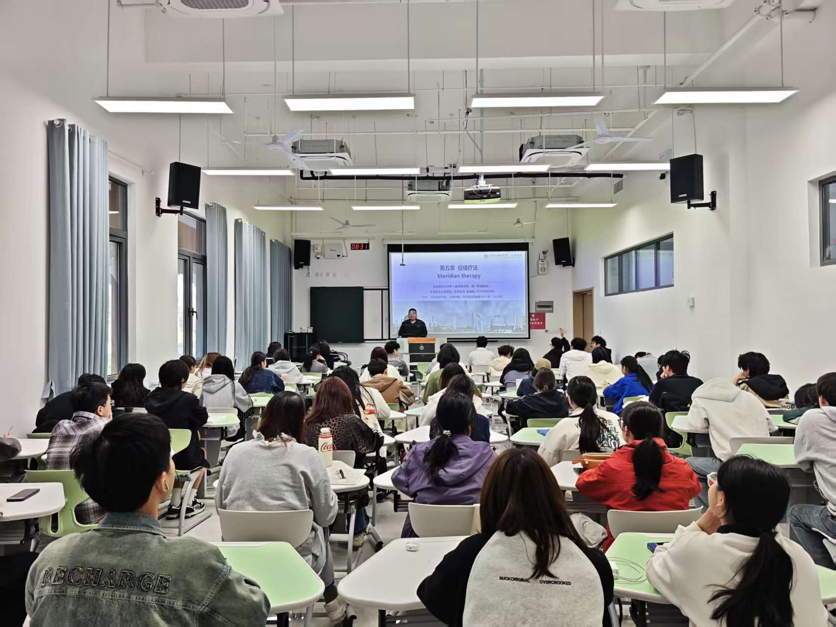 Meridian therapy course, large lecture format